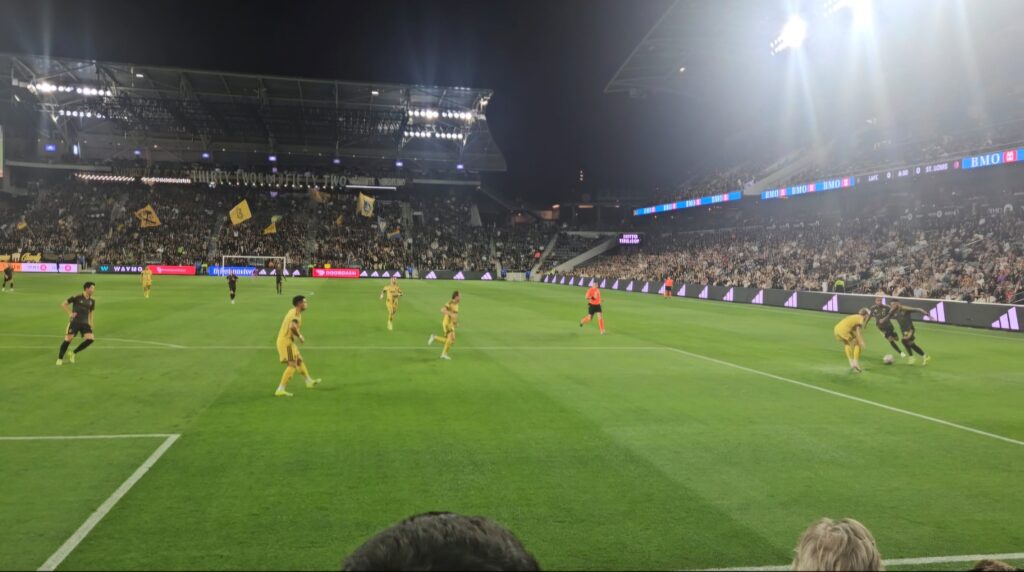 LAFC match atmosphere at BMO Stadium supporters section and field view